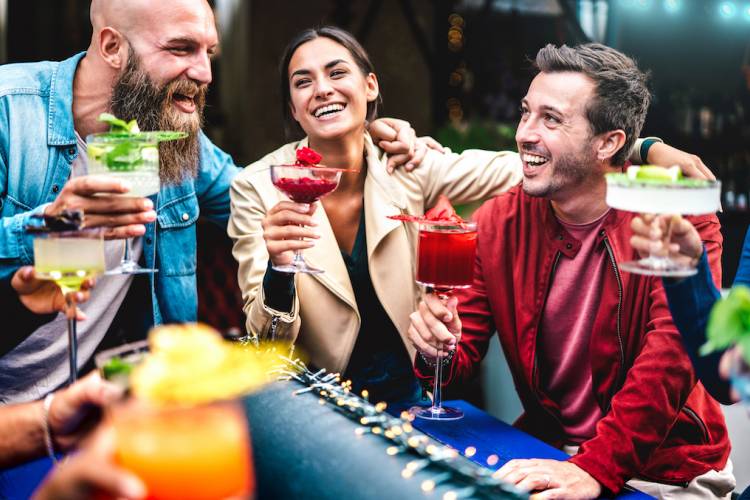 people hanging out and drinking at a bar