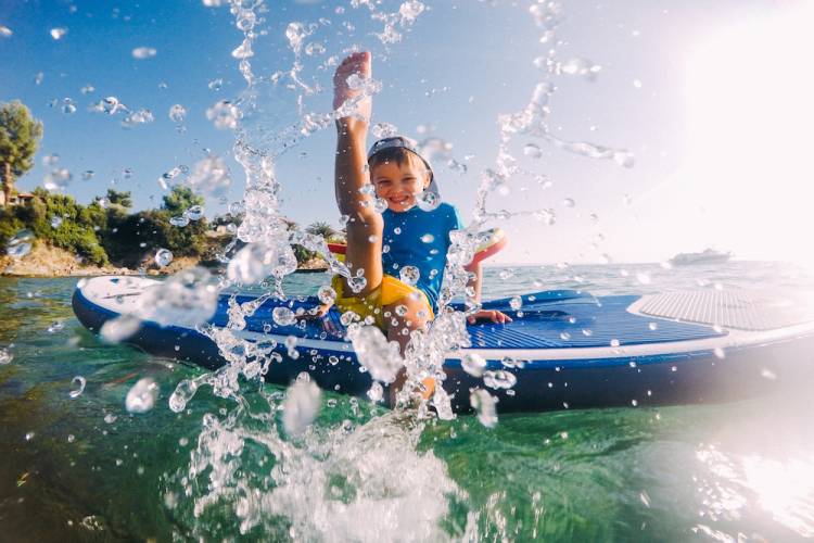 child on a paddleboard