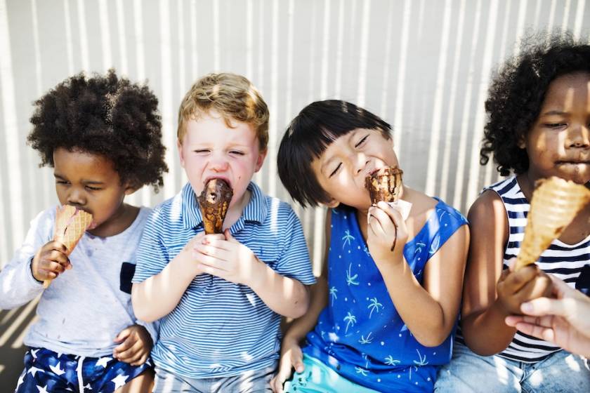 Multi ethnic children eating ice cream