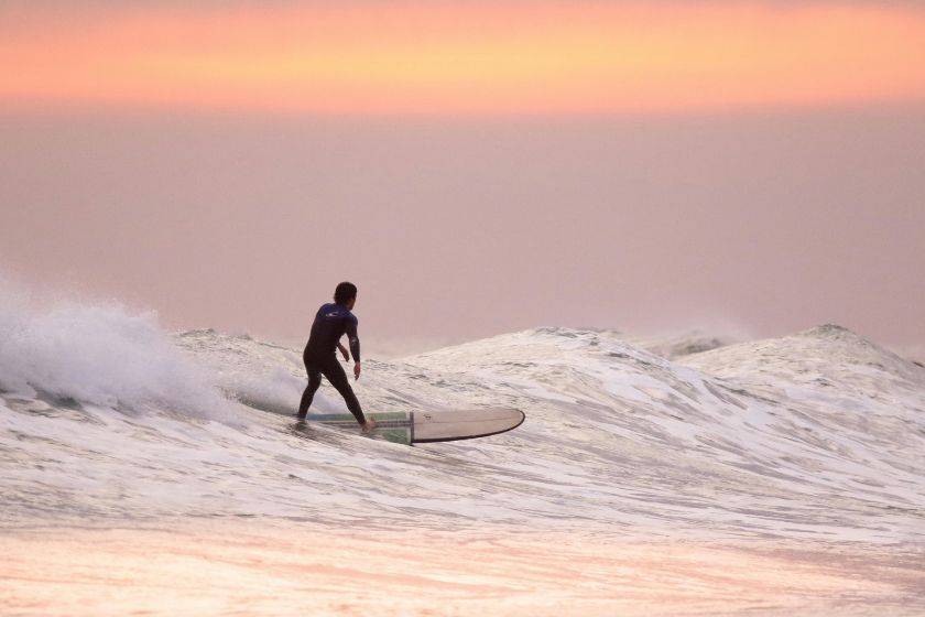 Surfing at Sandbridge Beach, VA.