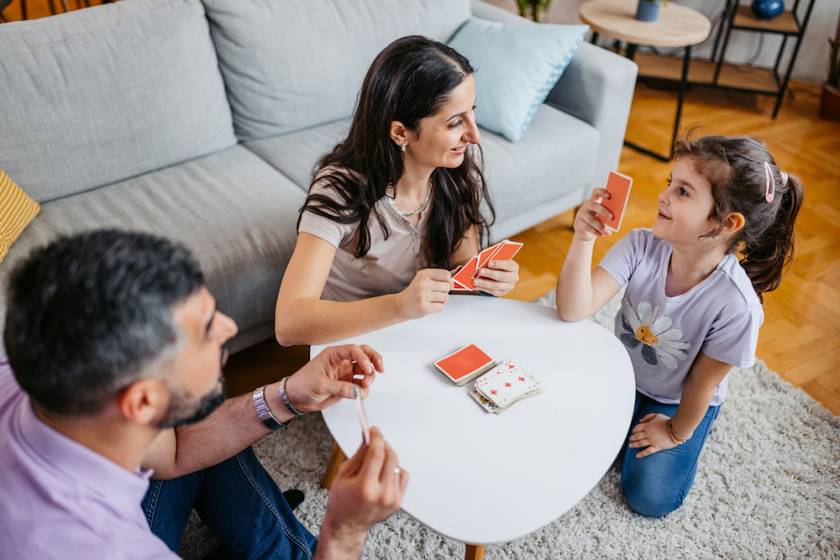 family playing a card game